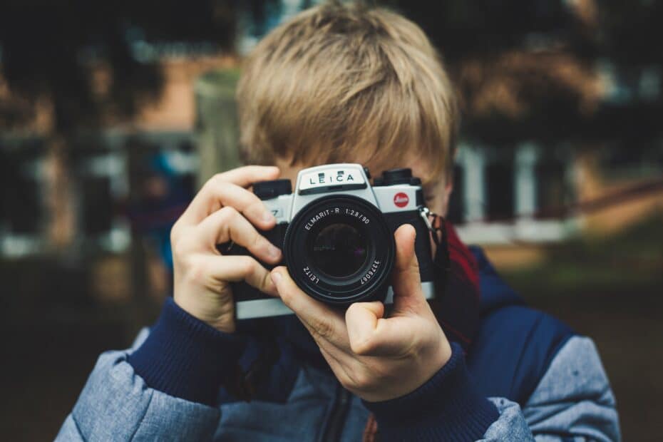 photo of man holding camera